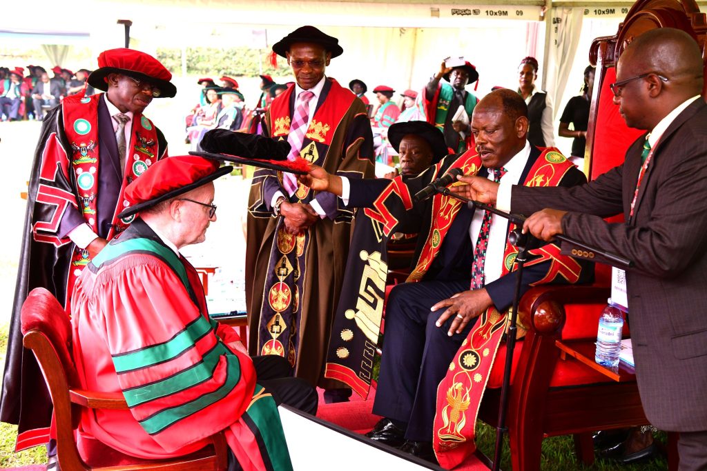 Professor Leif Abrahamsson receiving an Honorary Doctor of Science from Professor Barnabas Nawangwe at Makerere University's 74th graduation ceremony